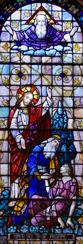 Stained glass at St. Joseph University Parish, Terre Haute, Indiana, USA. The legend, written in Latin, is translated, "Love of God, Love of Neighbor."