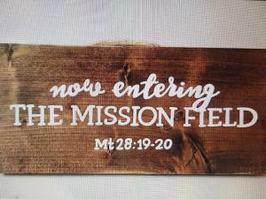 wooden sign about entering mission field with Bible reference