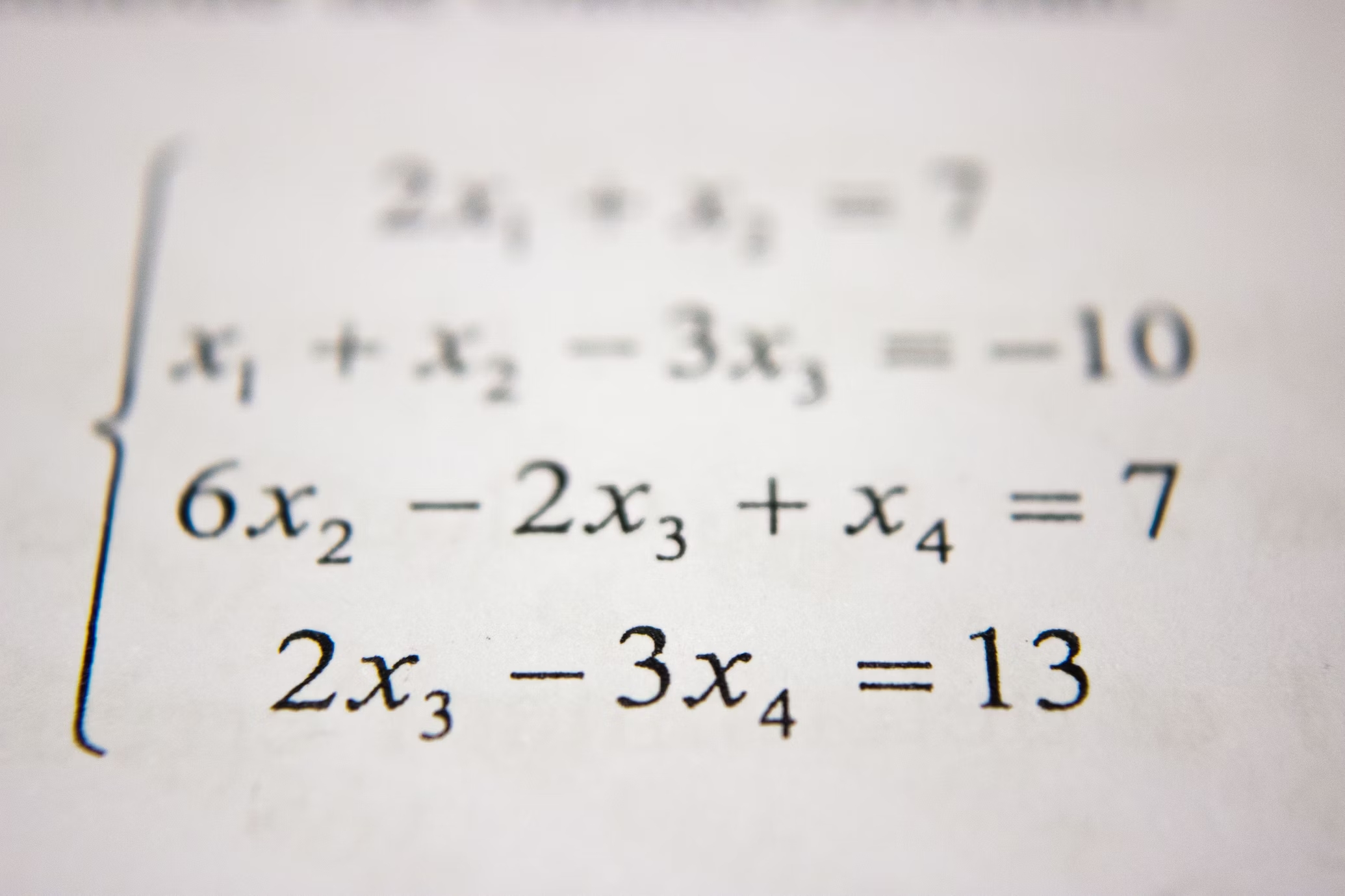 Math problems on white background involving X's