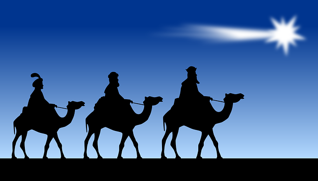 Three wise men on camels following a star