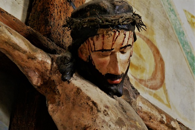 Close-up illustration of Jesus on the cross from the neck to the top of his head