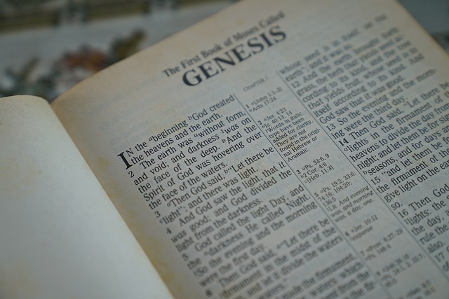 Bible opened to the first page of Genesis