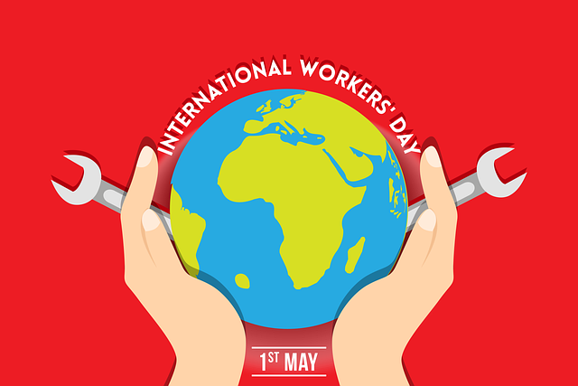 Illustration on red background of two hands holding up a globe with the notation International Workers Day May 1st