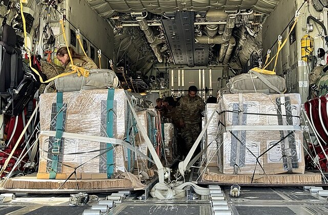 Pallets loaded into US military aircraft for humanitarian aid airdrop