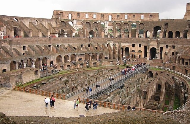 View of the interior remains of Rome's Colosseum with tourists inside