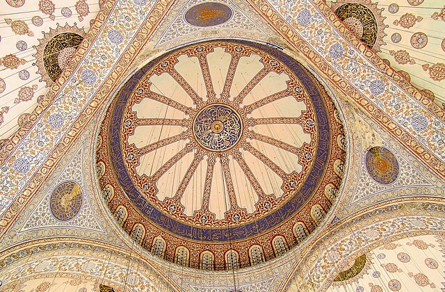 View upwards into the tiled domed ceiling of Istanbul's Blue Mosque