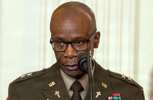 Photo of Maj. Gen. William Green from shoulders up in Army uniform, wearing glasses, and showing a bald head. 