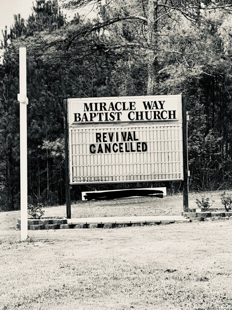 Revival Canceled is on a sign in front of a church.
