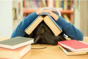 Student with book on head