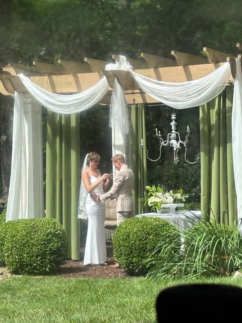 The bride and groom enjoy a private moment before the ceremony. Photo by author.