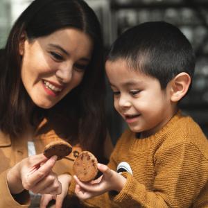 mom and son enjoying cookies