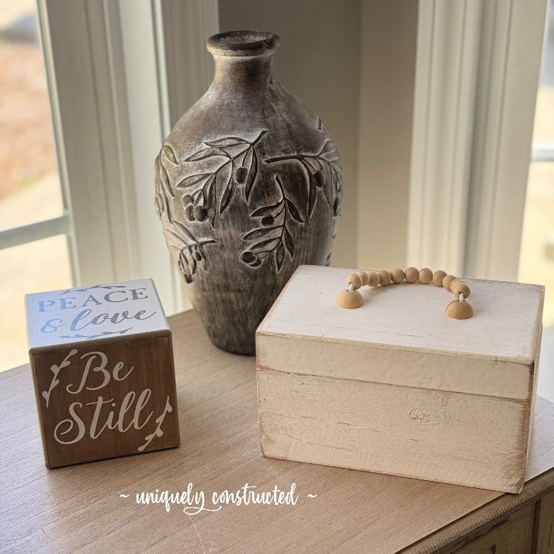 Simple picture with a decorative cube that says, "Be Still"