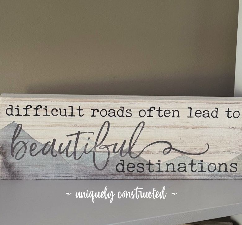 Sign with "Difficult roads lead to beautiful destinations."