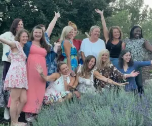 Ladies making fun and silly poses for the camera on the night before the Bloom Again KC event. 