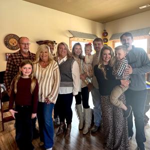 Family photo with children, grands and spouses.