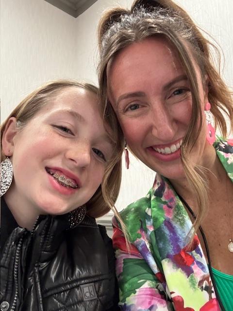Mother Daughter duo at Bloom Again Virginia Beach with big smiles on their faces.