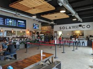 Interior of Sola Bread Co. and True Vine Brewing showing counters.