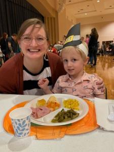 My wife and son at his school Thanksgiving Feast, celebrated annually since 1956