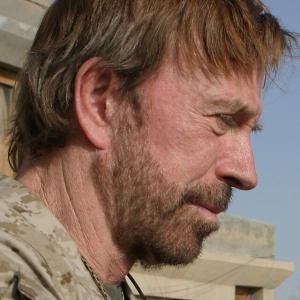 Photo | Chuck Norris at Camp Taqaddum in the Al Anbar province of Iraq November 2, 2006 | courtesy of Sergeant Alicia J. Brito, USMC, Wikimedia Creative Commons