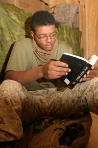 Photo | Lance Cpl. Lesley T. Raulerson reading a study bible, March 13, 2005 | courtesy of U.S. Marine Corps photo by Lance Cpl. Lucian Friel, Wikimedia Creative Commons
