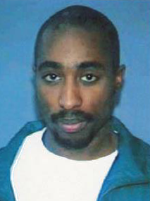 Photo | Tupac Shakur California driver's license photo, 1996 | courtesy of State of California, DMV, Wikimedia Creative Commons