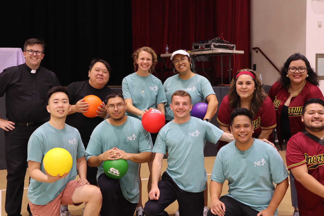 Group of young people holding dodgeballs
