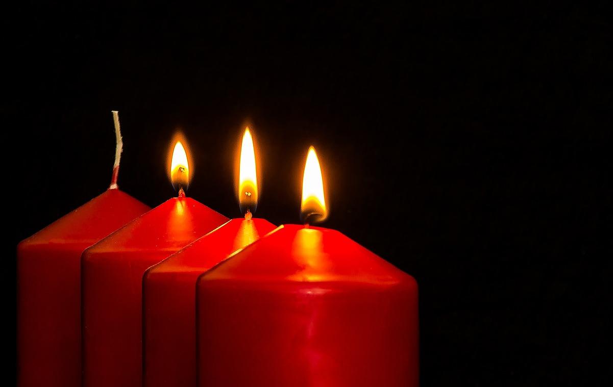 Three of four candles are lit, symbolizing the third Sunday of Advent