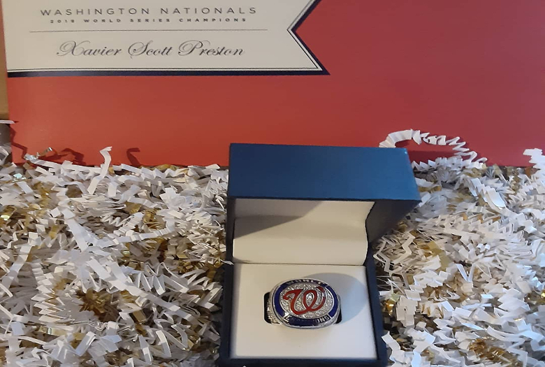 In honor of the Washington Nationals Faith Day, Xavier Scott Preston displays his replica 2019 Washington Nationals World Series Championship ring. He earned this ring as a part-time staff member with the Nats Guest Experience Department.