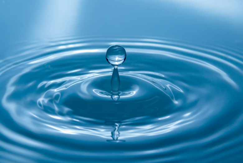 This image represents World Water Day as a drop of H20 enters a larger body of water. 