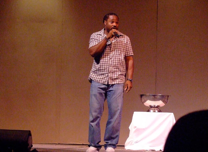 Malcolm-Jamal Warner performing on stage.