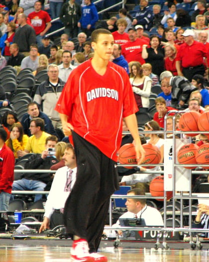 Davidson star Stephen Curry warms up for the Midwest Regional final against Kansas at Ford Field.