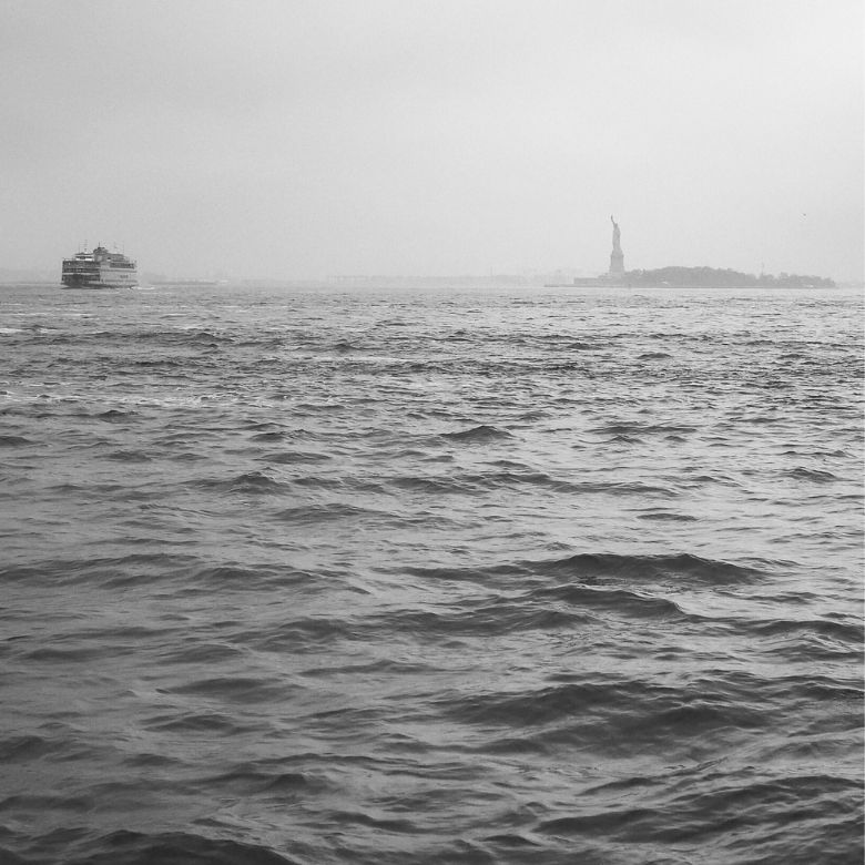 The Ocean, The Statue of Liberty on a Grey Day.
