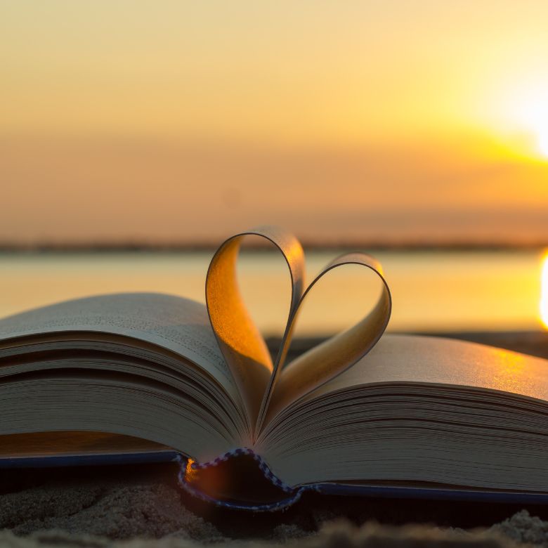 Heart in a book during sunset