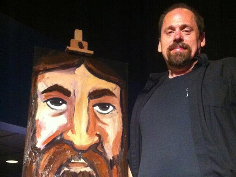 The author with his painting on forgiveness