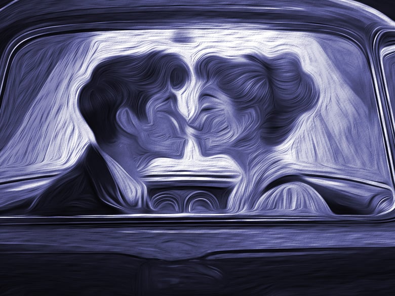 Young couple kissing by the dashboard light