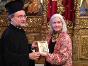 Rev. John Chryssavgis giving an icon to Terry Tempest Williams as a gift from the Patriarch Bartholomew.