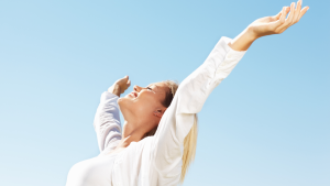 Woman with arms outstretched for freedom