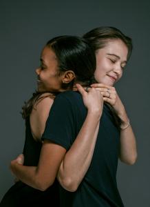 Two ladies hugging