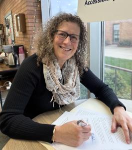 The author signing a book contract.