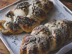 Two loaves of Challah on a baking sheet