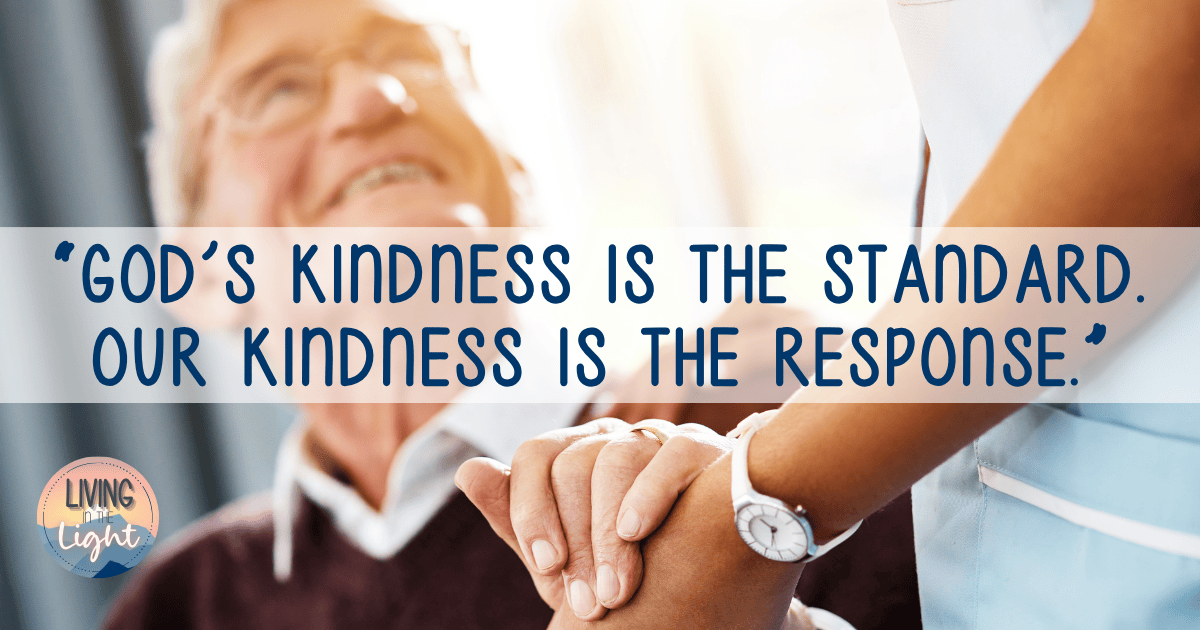 Nurse holding an elderly man’s hand with the quote “God’s kindness is the standard. Our kindness is the response.”