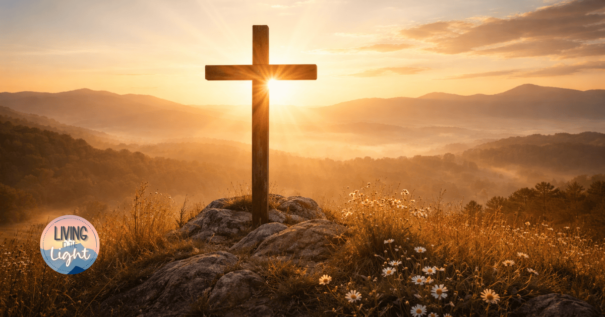 Wooden cross on a hill at sunrise overlooking mountains, symbolizing Christ as the focus for the year ahead.