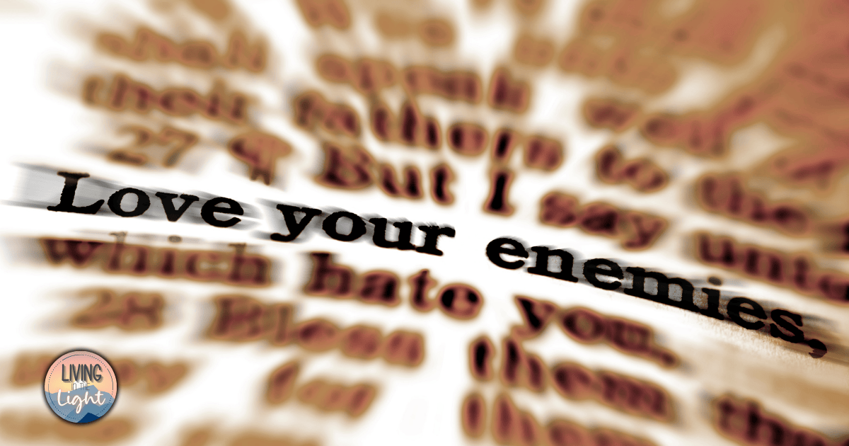 Close-up of the words “Love your enemies” in sharp focus, surrounded by blurred Scripture text, emphasizing the difficulty and weight of Jesus’ teaching in Matthew 5:44.