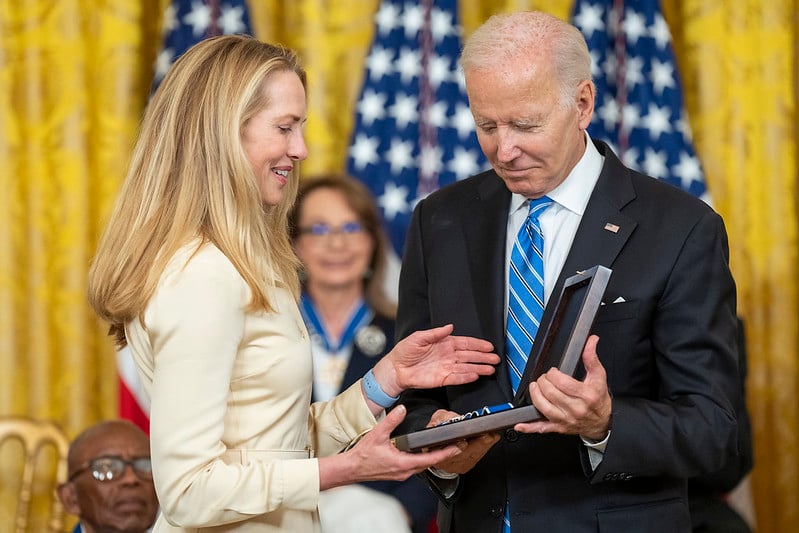 Lauren Powell receiving a medal from US President