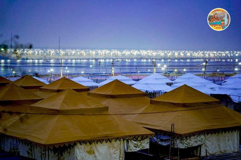 tents and glimmering lights on the horizon