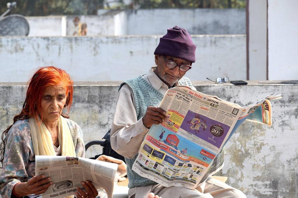 An elderly couple read the newspaper