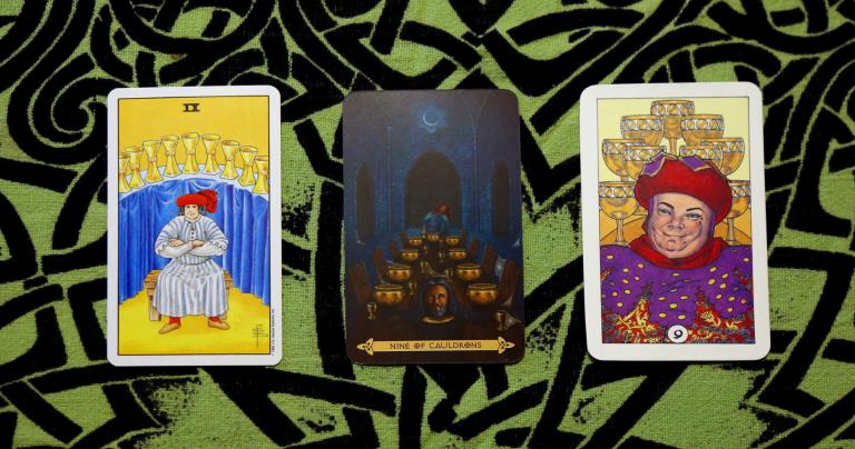 the Nine of Cups in the Rider-Waite-Smith Tarot, the Nine of Cauldrons in the Celtic Tarot, and the Nine of Cups in the Robin Wood Tarot
