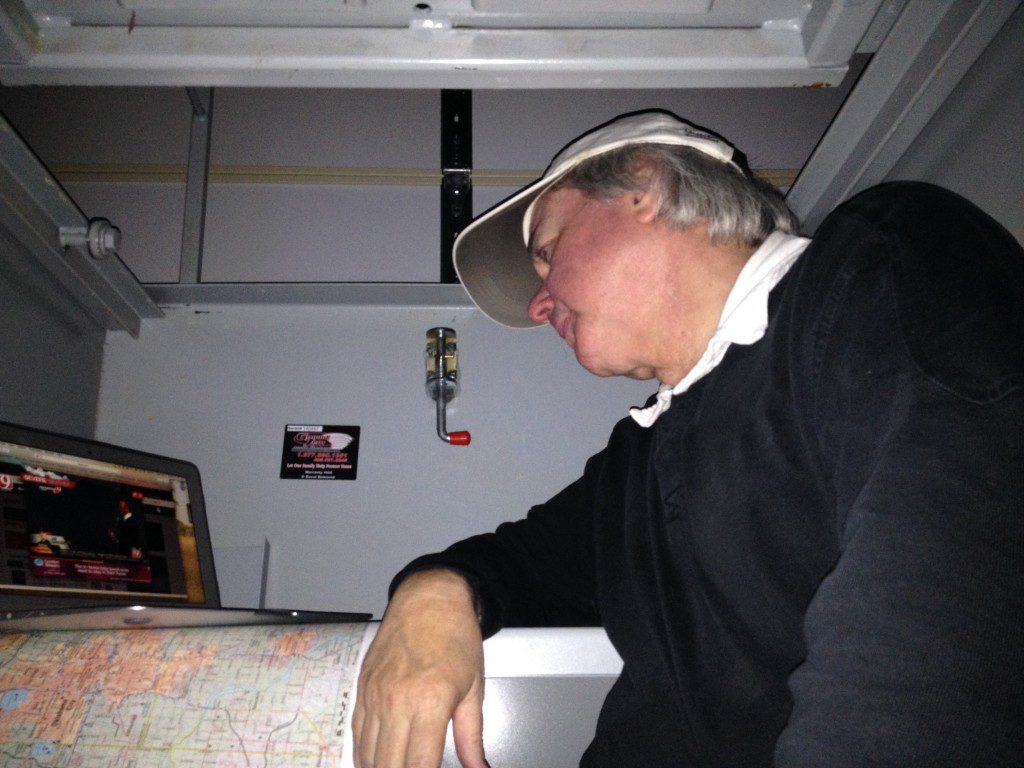 My wonderful husband, watching the storms on my computer. He's claustrophobic, so he sits on the stairs with the lid open. Copyright Rebecca Hamilton. All Rights Reserved. 