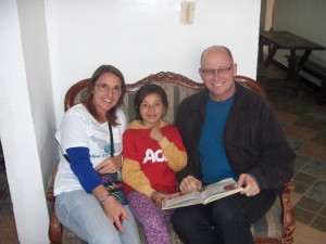 Carolyn and Terry reading to Nicole