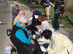 Fr. Roy Bourgeois, former Maryknoll Priest, and two ordained Roman Catholic Women Priests, Janice Sevre Duszynska and Jane Via, wash feet outside the Vatican Embassy in Washington DC on Holy Thursday 2016